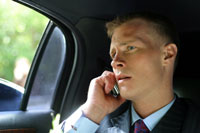 Corporate Businessman traveling in Limousine